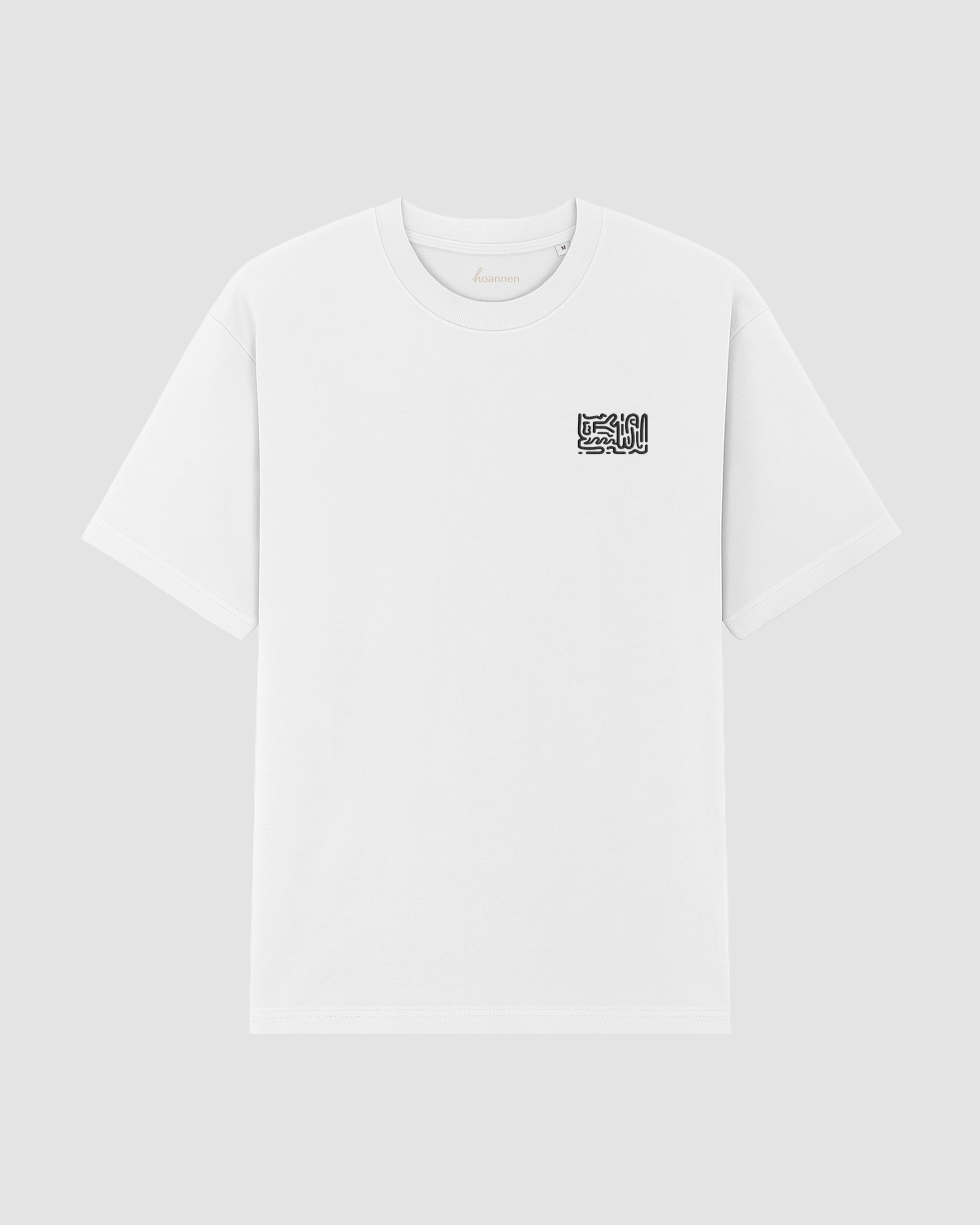 Flat lay of white oversized t-shirt with detailed embroidery on front
