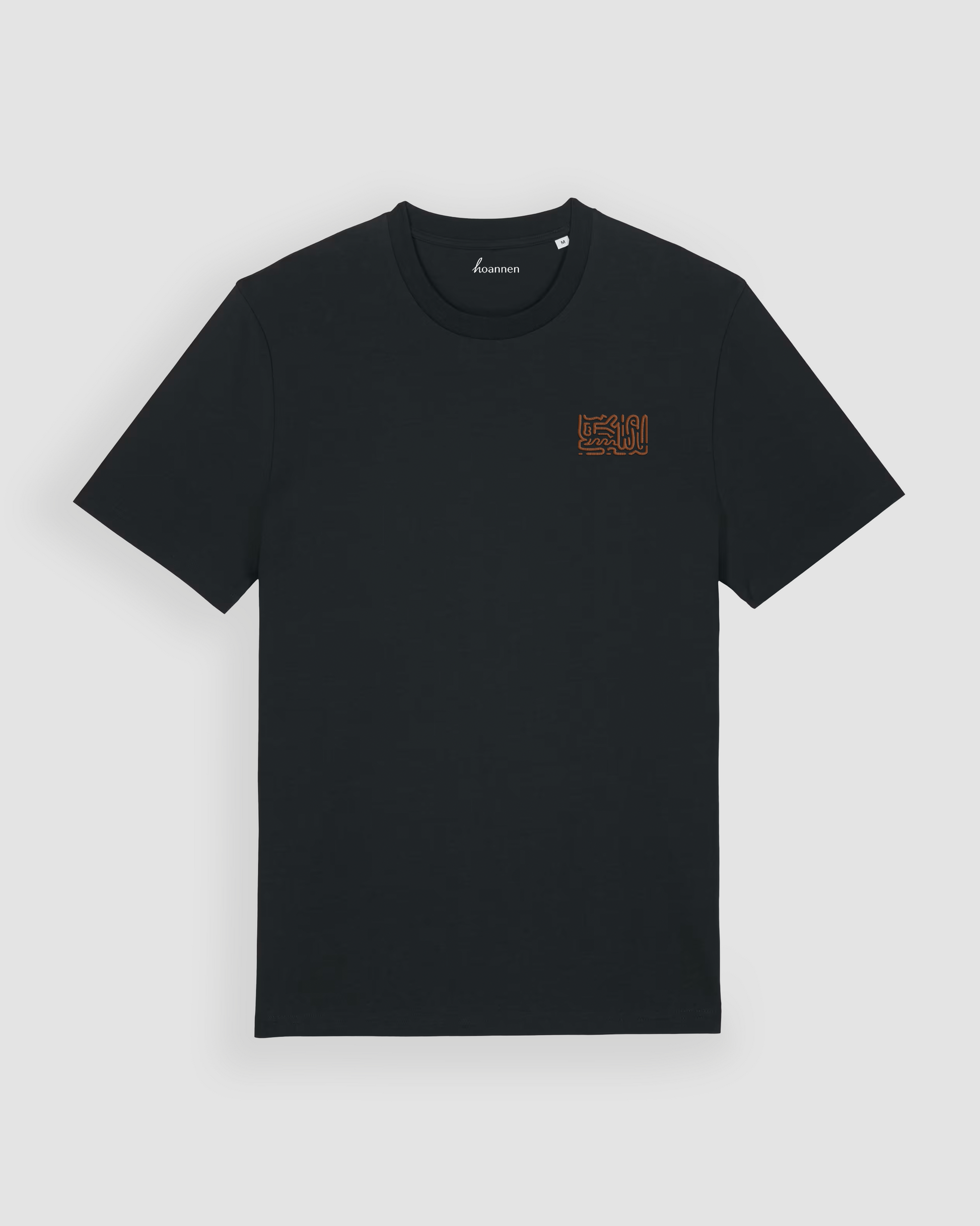 Flat lay of black regular fit t-shirt featuring chest embroidery in brown tone