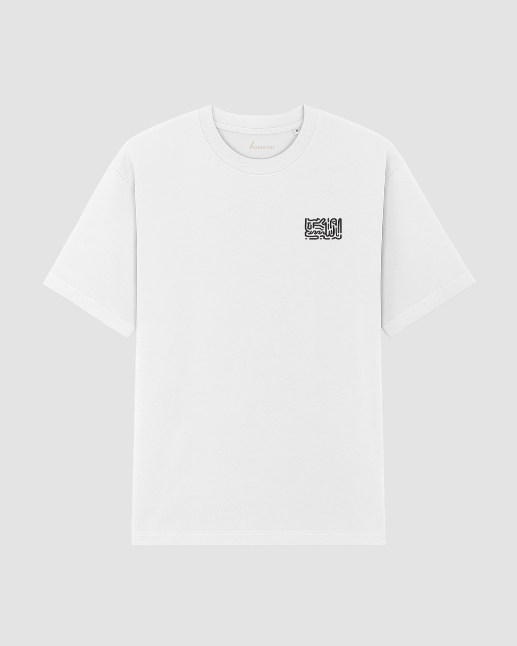 Flat lay of white oversized t-shirt with detailed embroidery on front